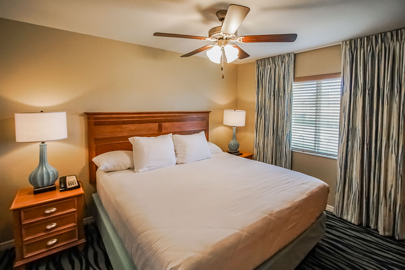 A cozy master bedroom at VRI's Fantasy World Resort in Florida.